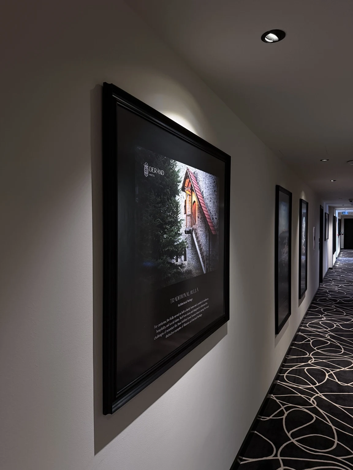 Framed artwork in a Derand Hotel corridor
